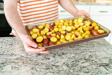 Roasting Halved Mixed Marble Potatoes in Modern Kitchen