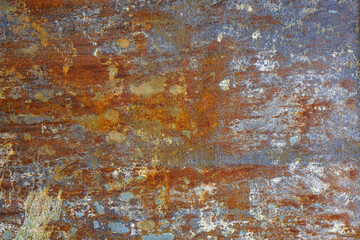 flat artistically rusted steel surface with leftovers of gray paing - full-frame background and...