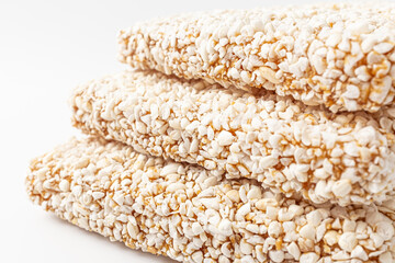 Traditional Korean snack made from glutinous rice and grain syrup on white background