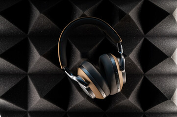 headphones on a dark foam background with lights