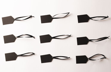 Rows of black price tags with copy space on white background