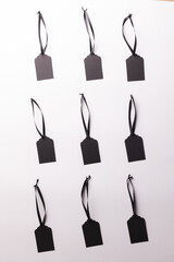Rows of black price tags with copy space on white background
