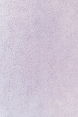 A purple textured stucco wall background