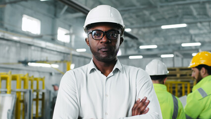 Close-up portrait of skilled experienced qualified African-American male engineer worker. Smart...