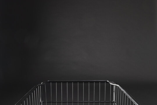 Shopping trolley with copy space over black background