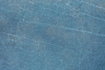 Dreamy aerial view of frozen Lake Champlain in the winter with reflective ice