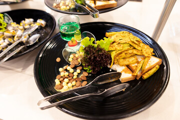 A dish of stewed vegetables on a plate in a restaurant