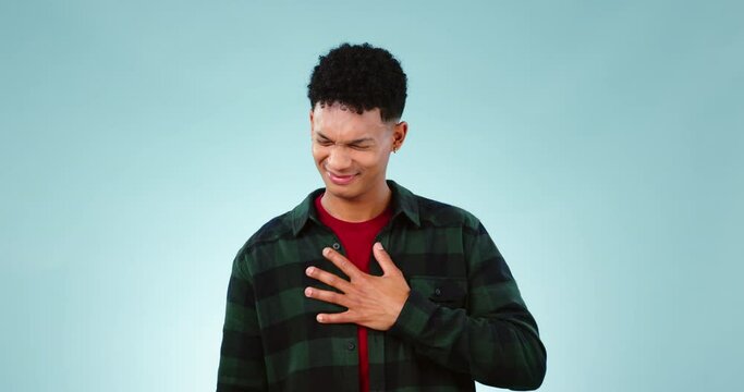 Chest pain, hands and man in studio with anxiety, asthma or virus and heartburn on blue background space. Breathe, problem and face of male model with stress, allergy or tuberculosis and indigestion