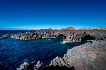Fototapeta premium Los Hervideros, Lanzarote, Canary Islands, Amazing place in Lanzarote. High cliffs, Atlantic Ocean, volcanoes. 