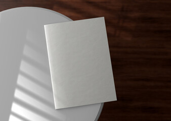 White plain blank empty A4 magazine on round white table 