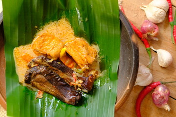 Mangut Ikan Asap is Traditional Indonesian cuisine made of smoked stingray, coconut milk, tofu,...