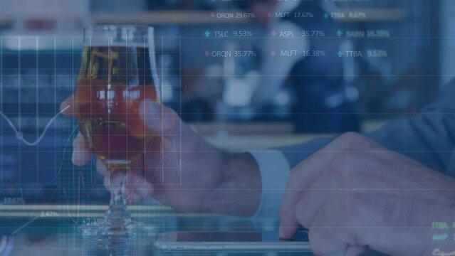 Animation of stock market data processing over mid section of a man using smartphone enoying a drink