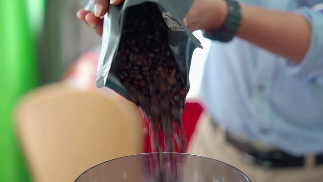 Put coffee beans into a coffee grinder