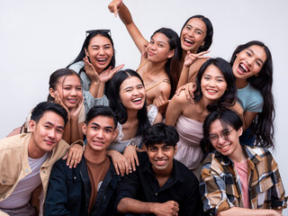 A diverse group of eleven young asian college students posing together looking happy. 6 women, 4 guys and 1 trans woman. Isolated on a white background.