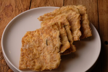 Keripik Tempe. Tempeh Chips is a typical Indonesian snack made from thinly sliced tempeh then fried...