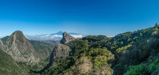 Foto op Canvas Panoramic scenic view from the Mirador del Bailadero with volcanic rock formations Los Roques and island Tenerife and Volcano Pico de Teide. Garajonay National Park on La Gomera, Canary Islands, Spain © Kristyna