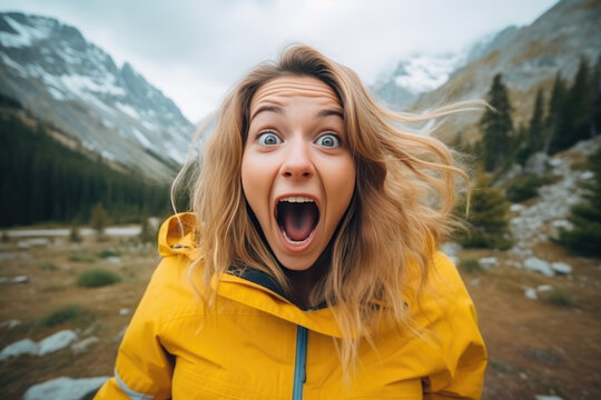 A Woman In A Yellow Jacket Making A Surprised Face