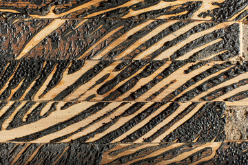 Glue pattern on wooden pieces. Demolition of glued wooden flooring.