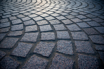 Paver brick floor, brick paving, paving stone or block paving. Manufactured from concrete or stone for road, path, driveway and patio. Empty floor in perspective view selective focus.