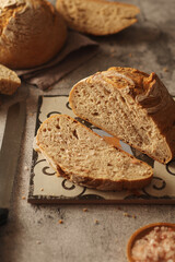A loaf of rye bread in low key