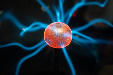 Detail of a plasma lamp, current rays on black background