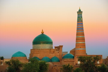 Minaret and madrasah of Islam-Khoja of the ancient city of Khiva at the sunrise, Uzbekistan. - 648012932