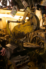 Iron mechanical machine yellow in the workshop