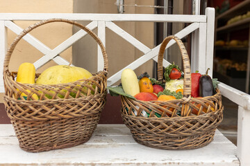 bunch of fresh gatheterd vegetables in wicked basket