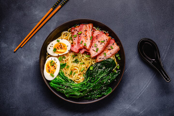 Traditional ramen noodle soup with brisket, spinach and egg.
