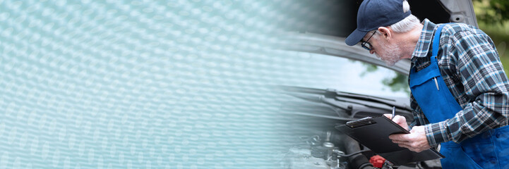 Car mechanic checking a car engine; panoramic banner