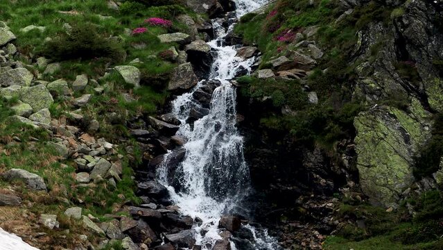 Waterfall in Rodnei National Park, Maramures, Romania, Europe. Lala Mare lake waterfall in springtime.