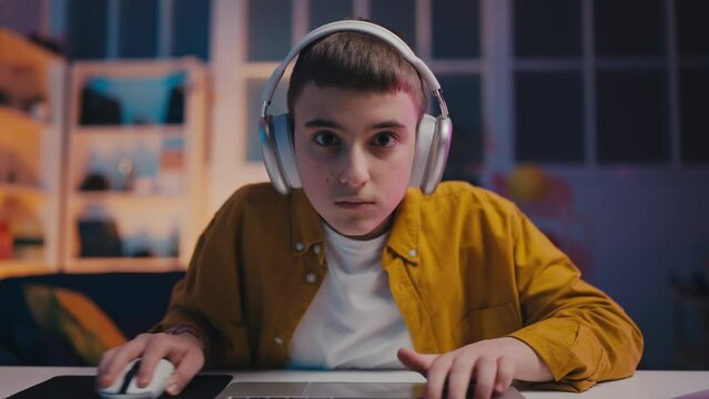 Teen boy getting angry after losing video game, anger issues, gaming addiction