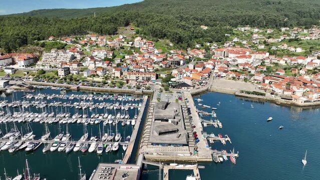Orbiting View of Combarro Harbor: Yachts and Arriving Boat