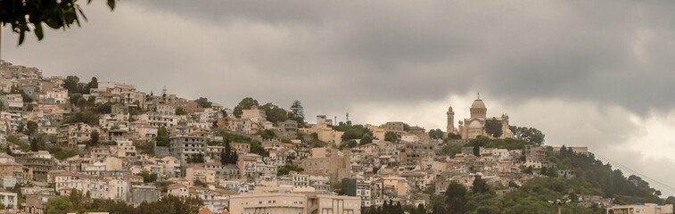 Wide angle panorama of Algiers, Alger, Algeria, with Notre Dame d'Afrique (English : Our Lady of Africa) in the background.