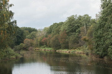 Lenaelva River by the Haajendammen Dam, Toten, Norway, in early fall.