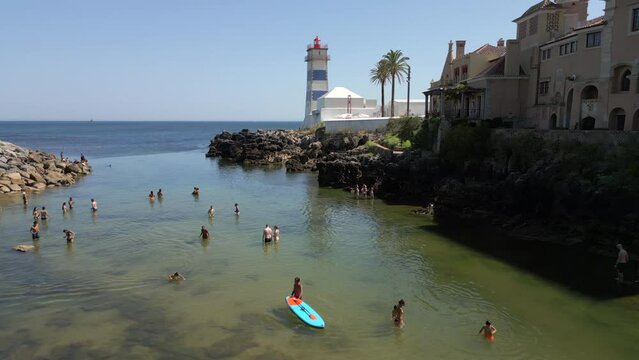 Aerial view of the historic Santa Marta Lighthouse during summer in Cascais, Lisbon District, Portugal.