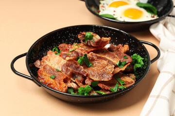 Tasty breakfast and delicious meat food concept - fried bacon