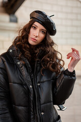 stylish woman in winter autumn fashion trend black puffer coat