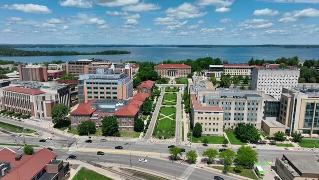 Henry Mall on University of Wisconsin campus in Madison, WI. Aerial truck shot of academic buildings with Lake Mendota in the background.