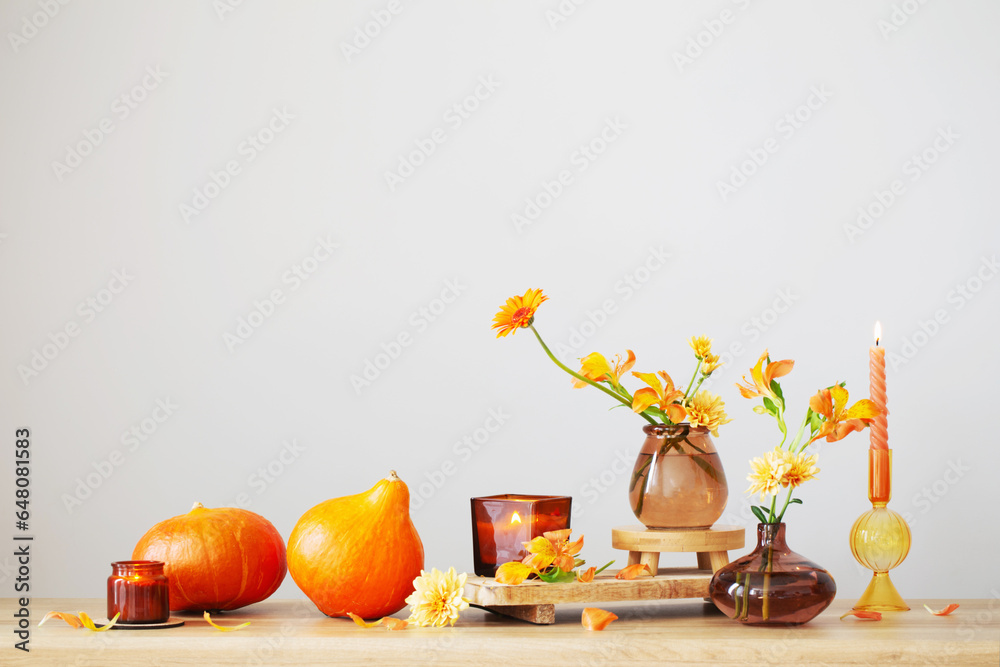 Poster autumn still life on wooden shelf on background wall