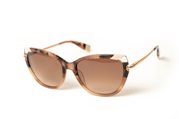 Brown elegant female Sunglasses isolated on white background. Sun glasses summer accessories as...