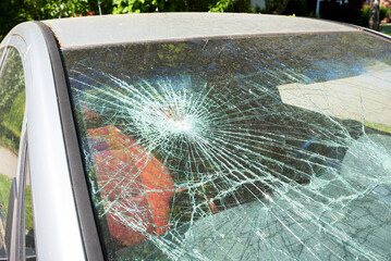 Car with a shattered windshield due to a violent break-in or accident