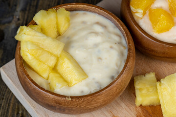 pineapple yogurt with slices of ripe yellow pineapple pineapples with fresh yogurt