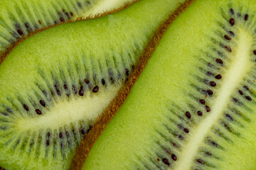 Ripe green kiwi sliced into thin slices