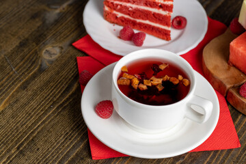 Red raspberry tea with pieces of fruit and berries