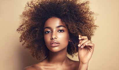 Beautiful black woman . Beauty portrait of african american woman with clean healthy skin on beige...