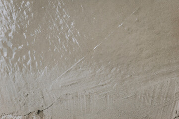 Background, texture of fresh cement, mortar, liquid gray concrete. Closeup photo, construction concept.