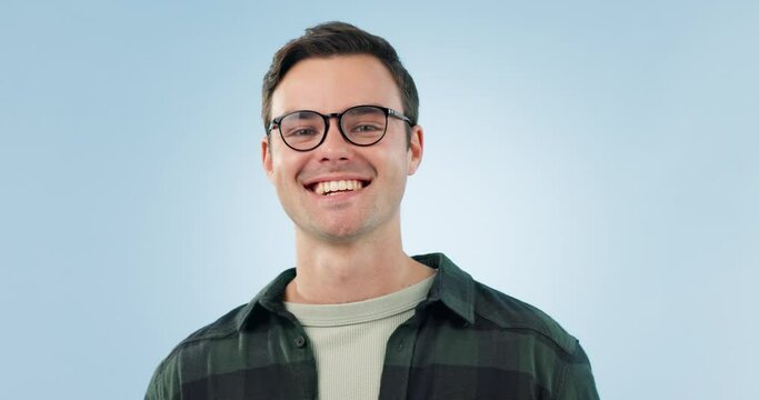 Glasses, happy and face of man on blue background for optometry, vision and eyewear product. Healthcare, optometrist and portrait of person with spectacles, frame and prescription lens in studio