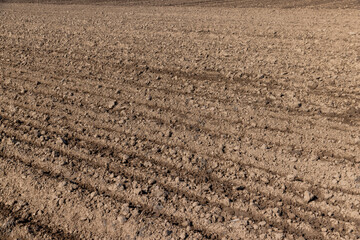 the plowed soil during preparation for sowing agricultural plants - 648091124