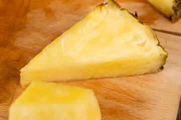 ripe yellow pineapple cut into pieces